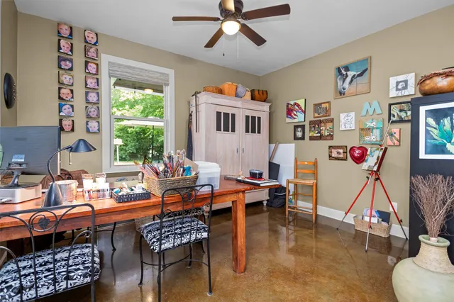 a bedroom with a bed furniture and a book shelf