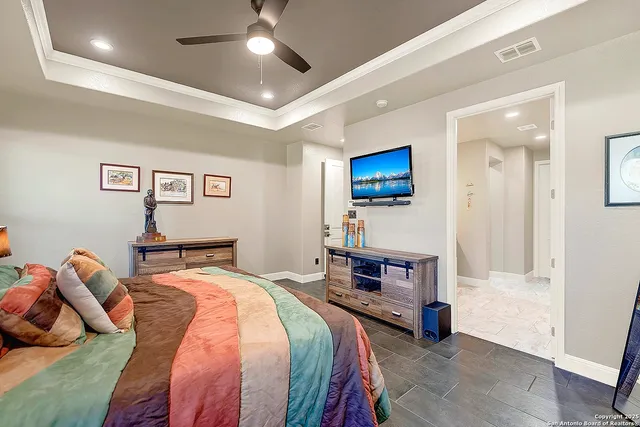 a bedroom with a bed and a couch