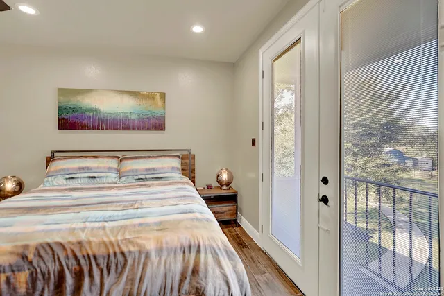 a bedroom with double bed and a window