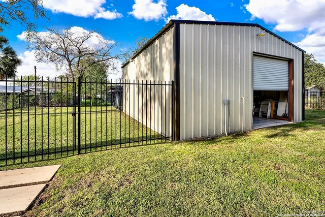 a view of garage with a table and chairs