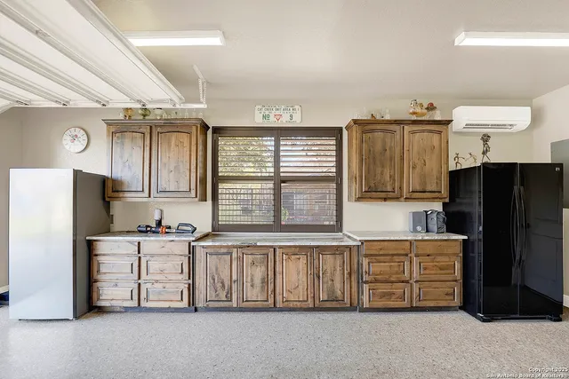 a bathroom with a granite countertop toilet a sink and mirror