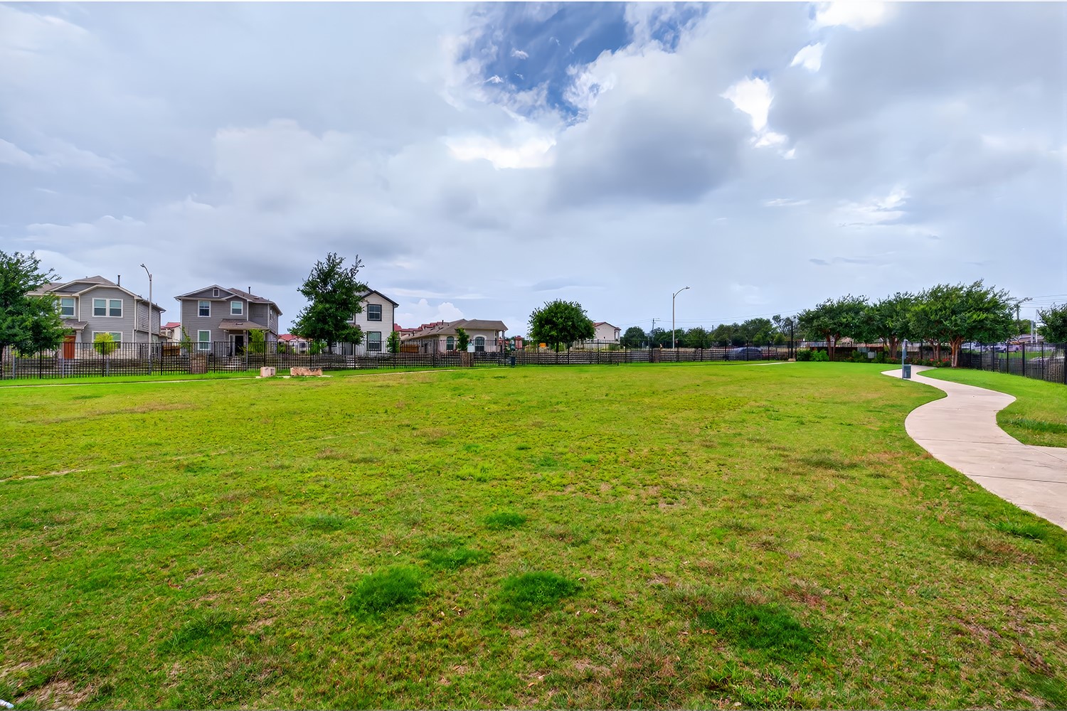 2006 Grow Lane Austin, TX 78754 - Photo 38 of 40 Green space provides a tranquil escape, with winding pathways and distant residential views.