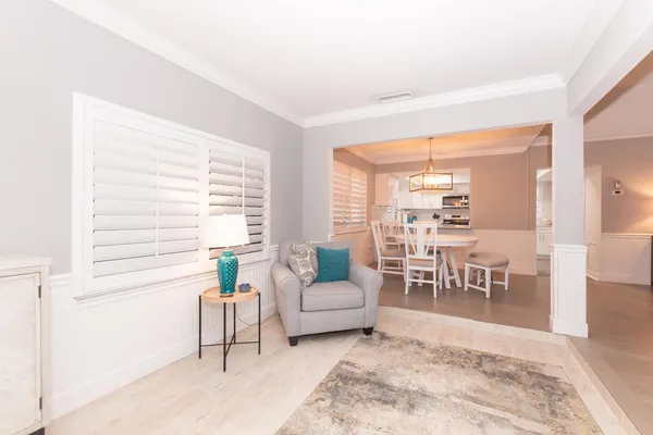 a living room with furniture and a table