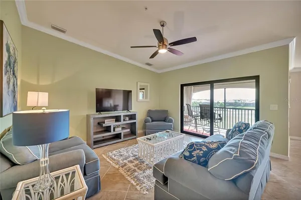 a view of a dining room with furniture wooden floor and a chandelier