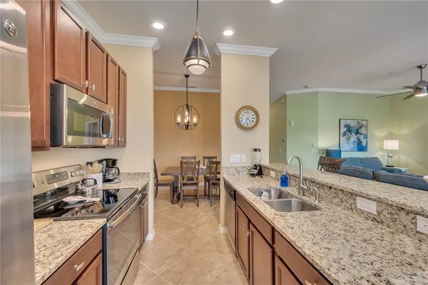 a bathroom with a granite countertop sink mirror toilet and bathtub