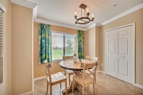 a large bed sitting in a bedroom next to a window