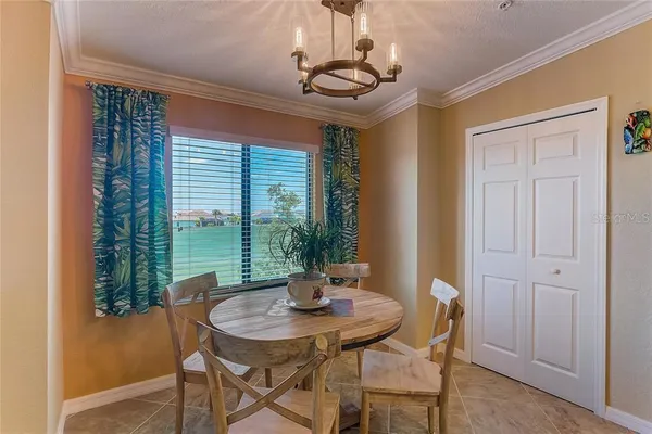 a bathroom with a granite countertop sink toilet mirror and bathtub