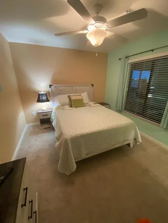 a view of a swimming pool with a yard