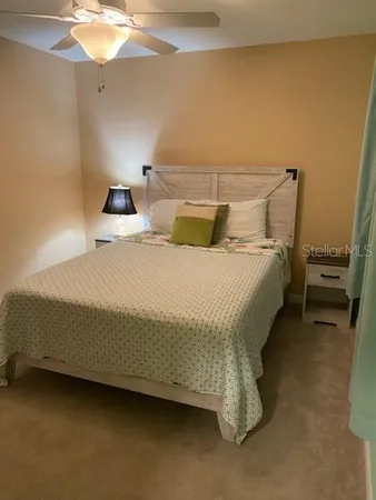 a view of a backyard with a table and chairs