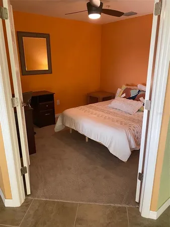an aerial view of a house with a garden and a swimming pool