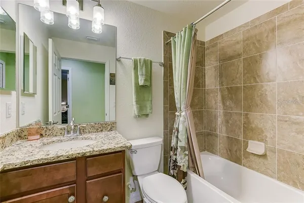 an aerial view of residential houses and outdoor space