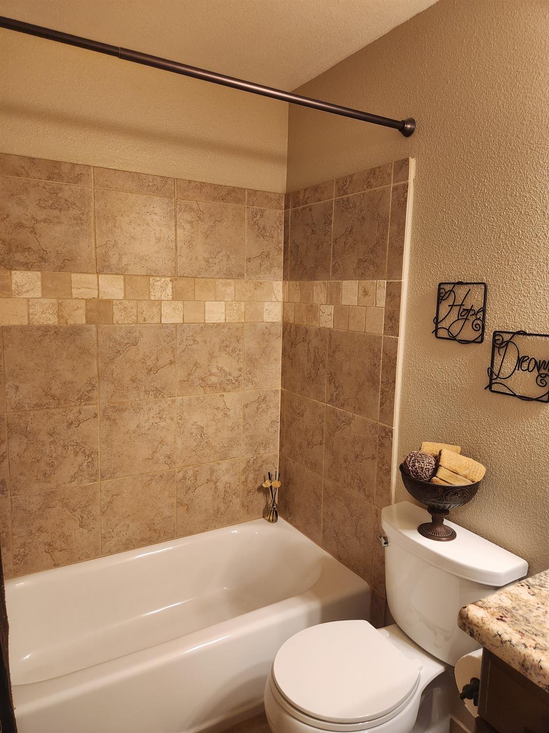 777 Jordanolo Drive Ripon, CA 95366 - Photo 24 of 61 a bathroom with a toilet and a shower