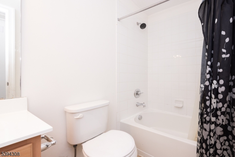 11 Panfili Lane Hamilton, NJ 08610 - Photo 19 of 29 a white toilet sitting next to a bath tub