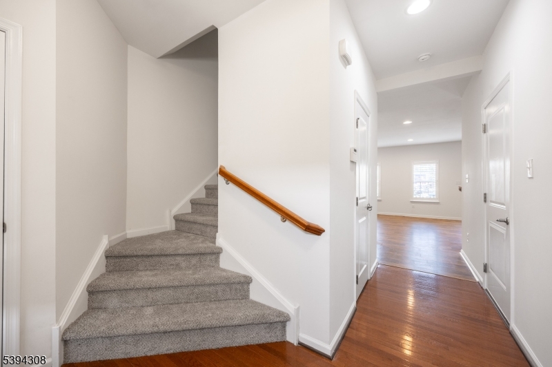 11 Panfili Lane Hamilton, NJ 08610 - Photo 7 of 29 a view of a hallway with wooden floor and staircase