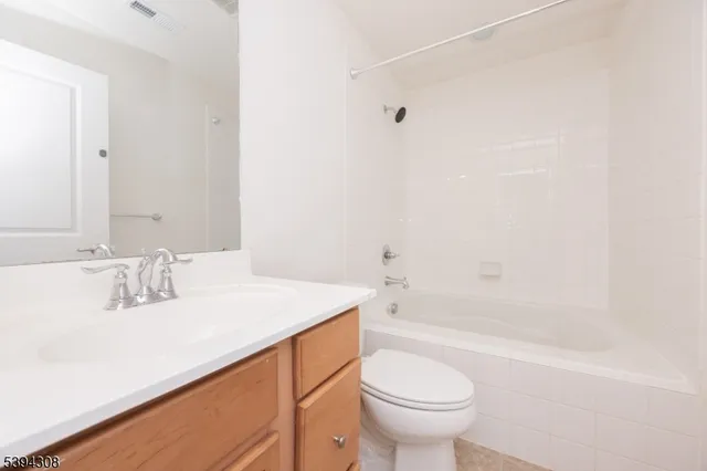 a bathroom with a sink a toilet and a bathtub
