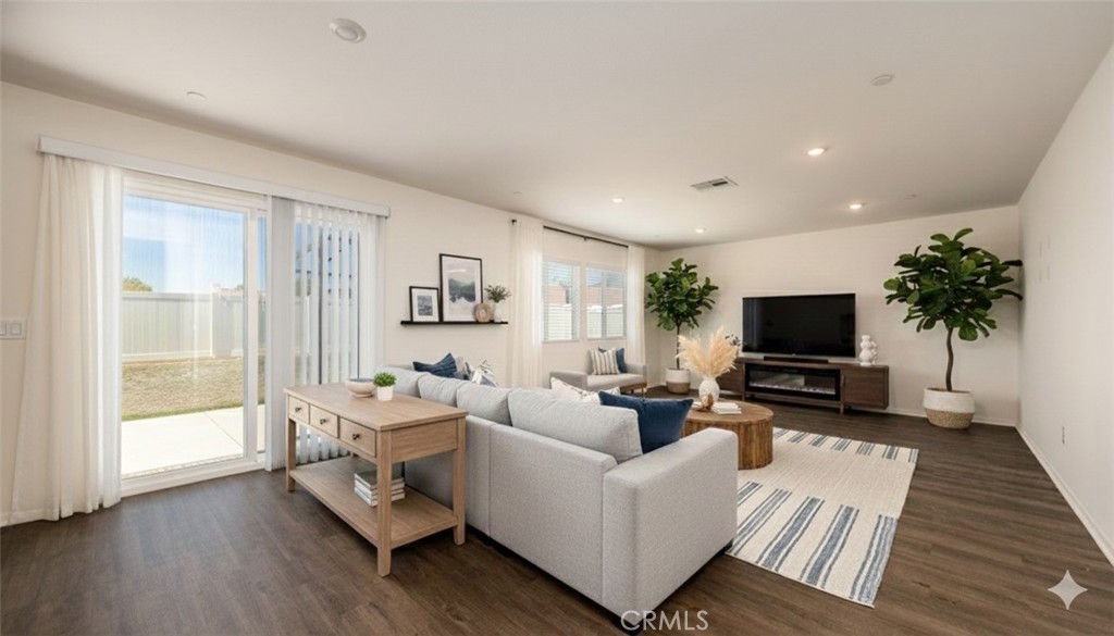 1455 Honor Way Hemet, CA 92543 - Photo 1 of 15 a living room with furniture and a flat screen tv