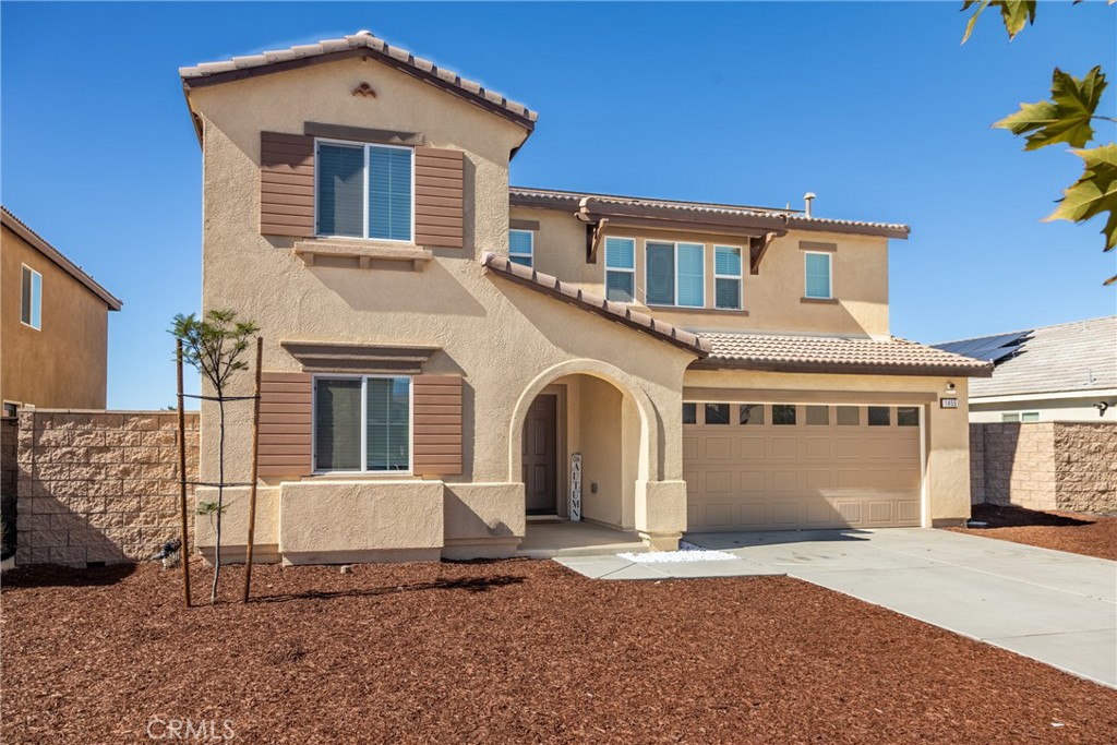 1455 Honor Way Hemet, CA 92543 - Photo 13 of 15 a front view of a house with a yard