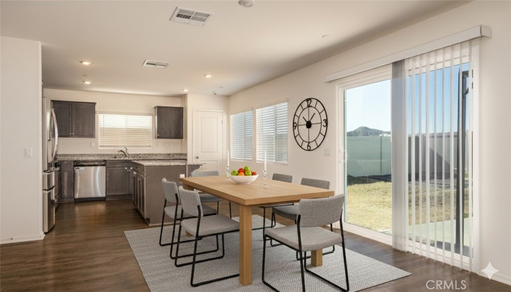1455 Honor Way Hemet, CA 92543 - Photo 2 of 15 a view of a dining room with furniture window and wooden floor