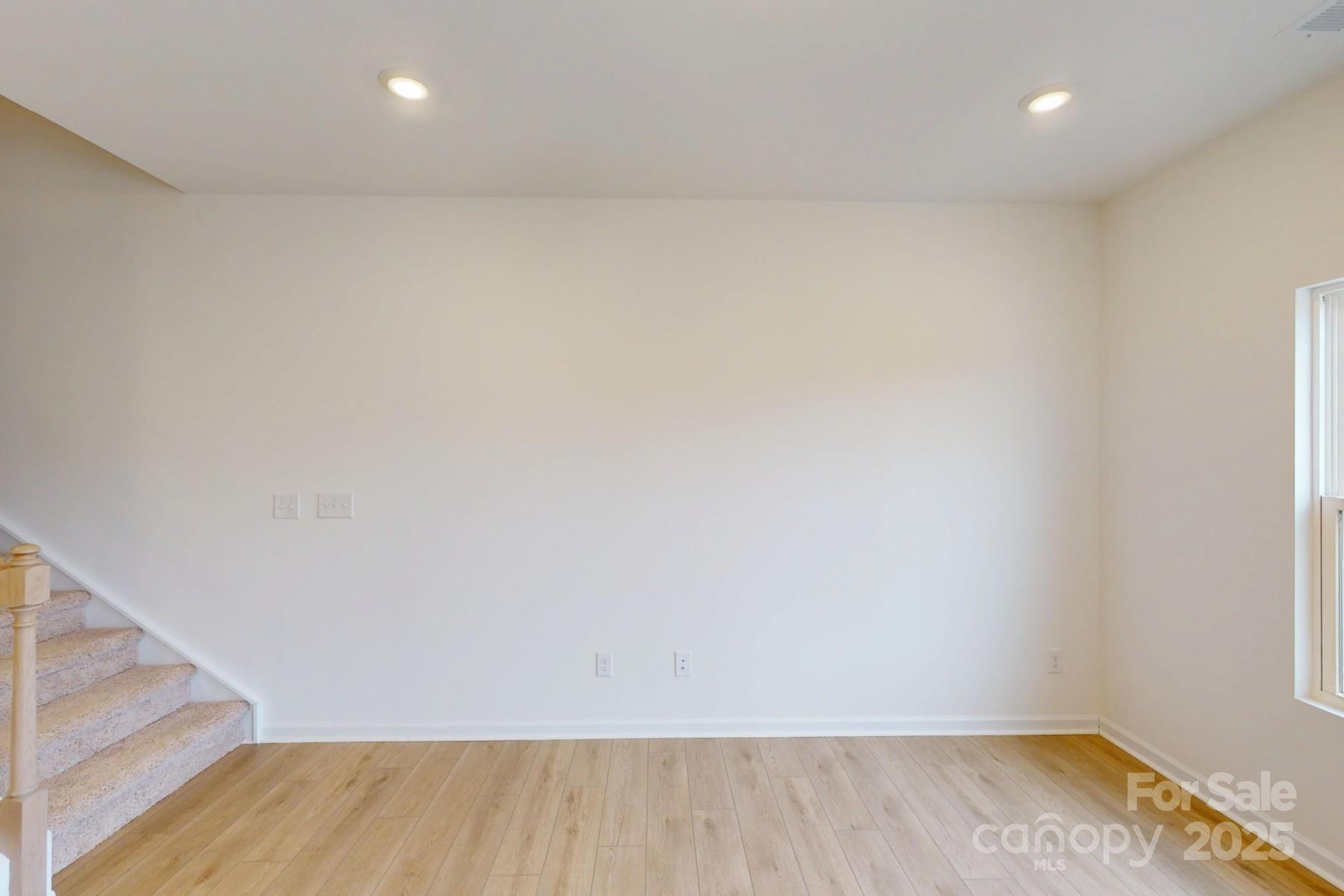 1018 Overbrook Place Wingate, NC 28174 - Photo 11 of 23 a view of room with wooden floor