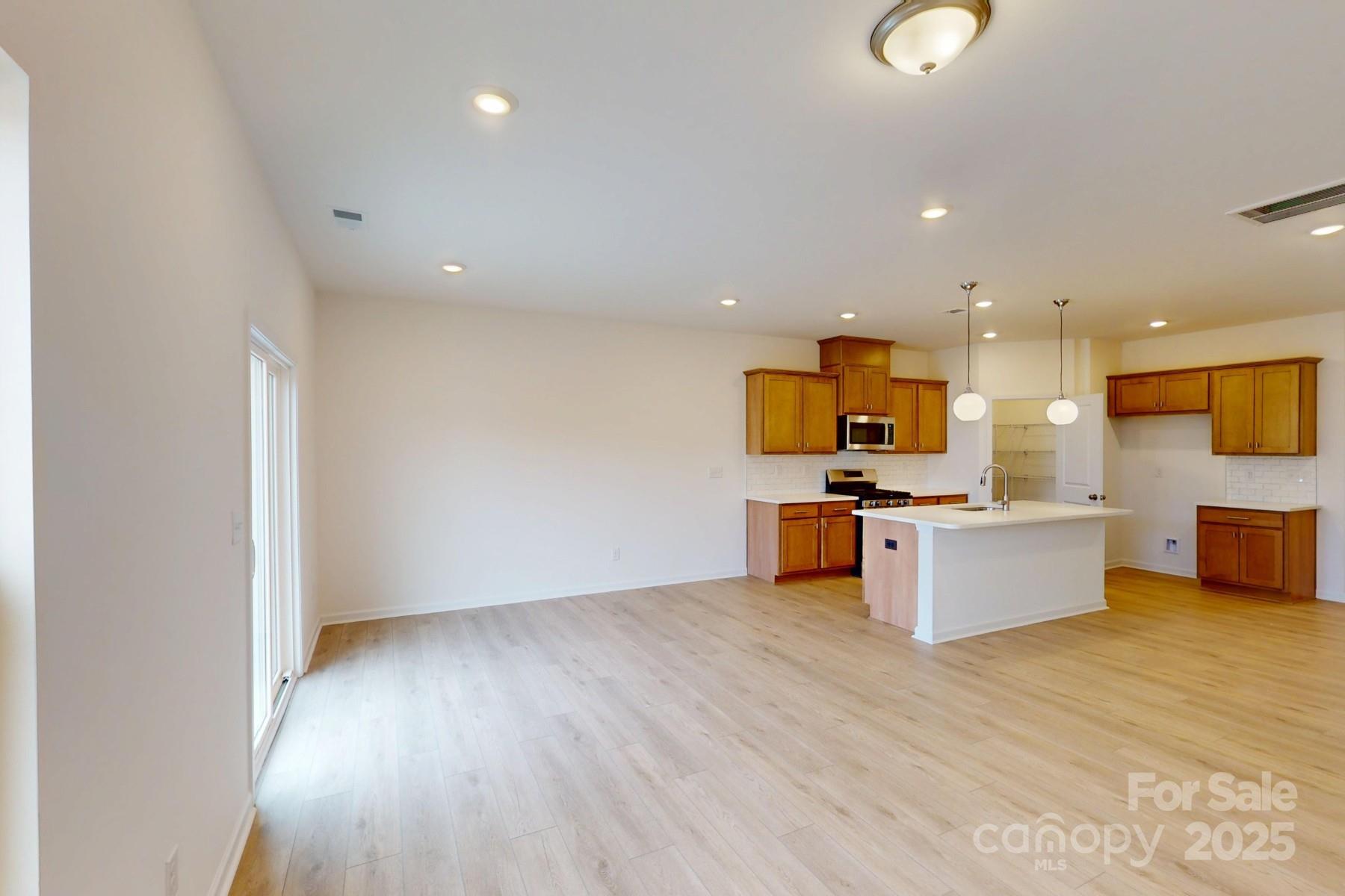 1018 Overbrook Place Wingate, NC 28174 - Photo 12 of 23 a view of kitchen with wooden floor