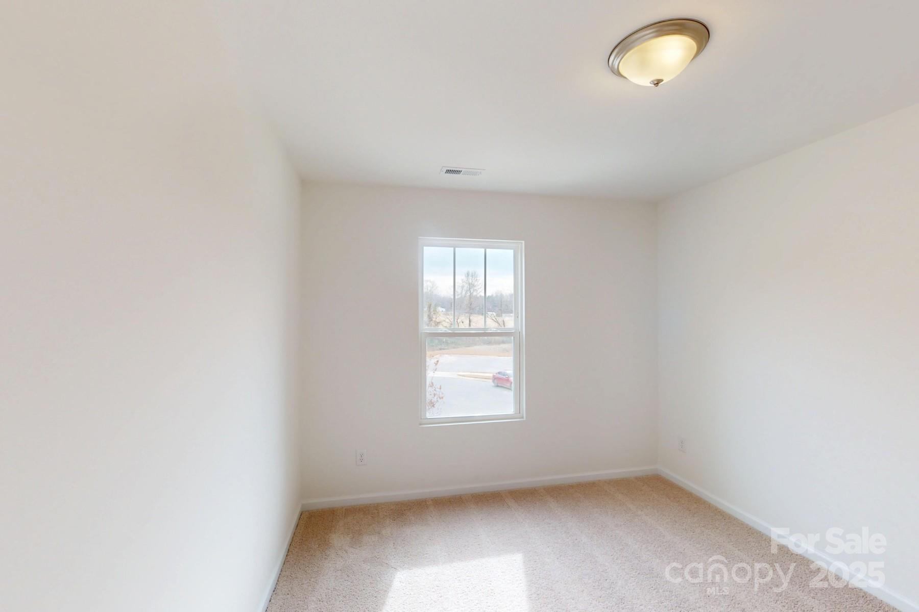 1018 Overbrook Place Wingate, NC 28174 - Photo 14 of 23 an empty room with a window