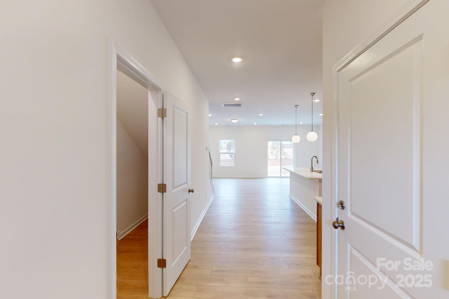 1018 Overbrook Place Wingate, NC 28174 - Photo 3 of 23 a view of a hallway with wooden floor