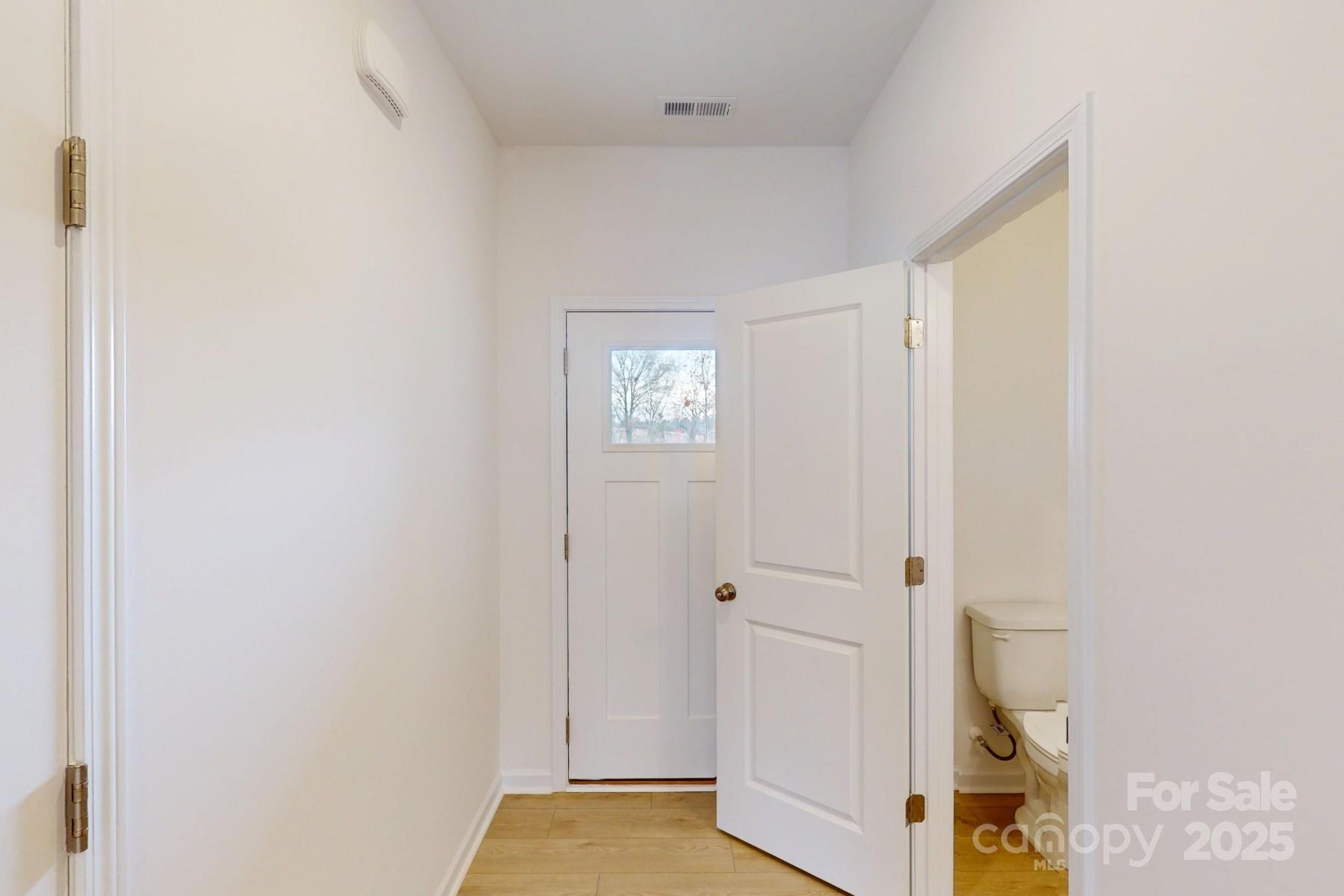 1018 Overbrook Place Wingate, NC 28174 - Photo 4 of 23 a view of a hallway with paintings on the wall