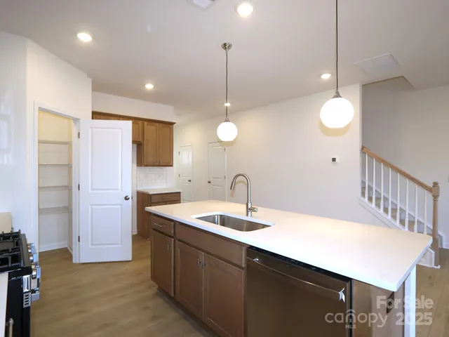 a kitchen with sink cabinets and window