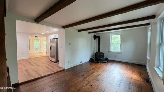 a open kitchen with sink cabinets and wooden floor