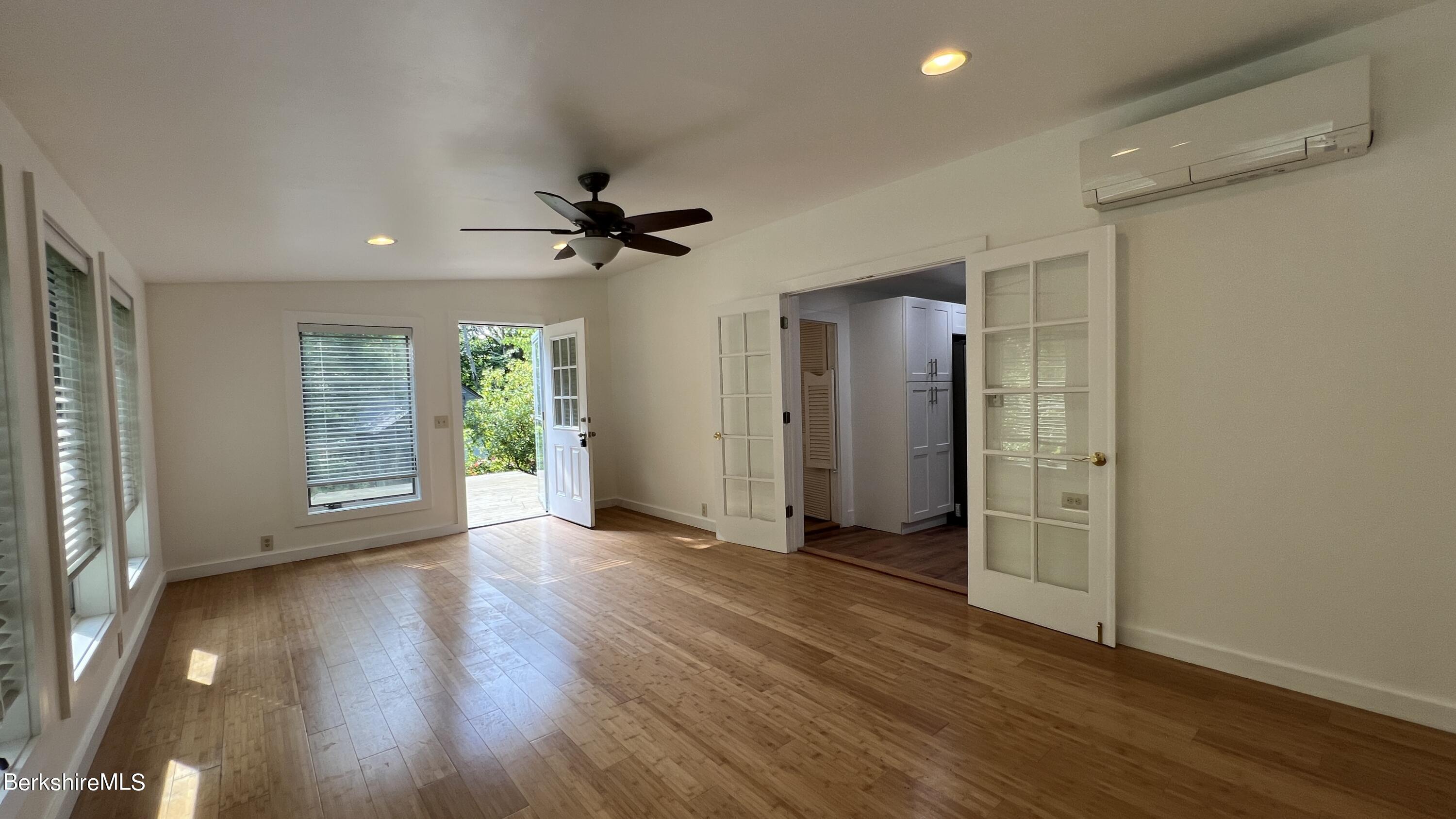 190 Willow Street Lee, MA 01260 - Photo 13 of 41 a view of an empty room with window and wooden floor