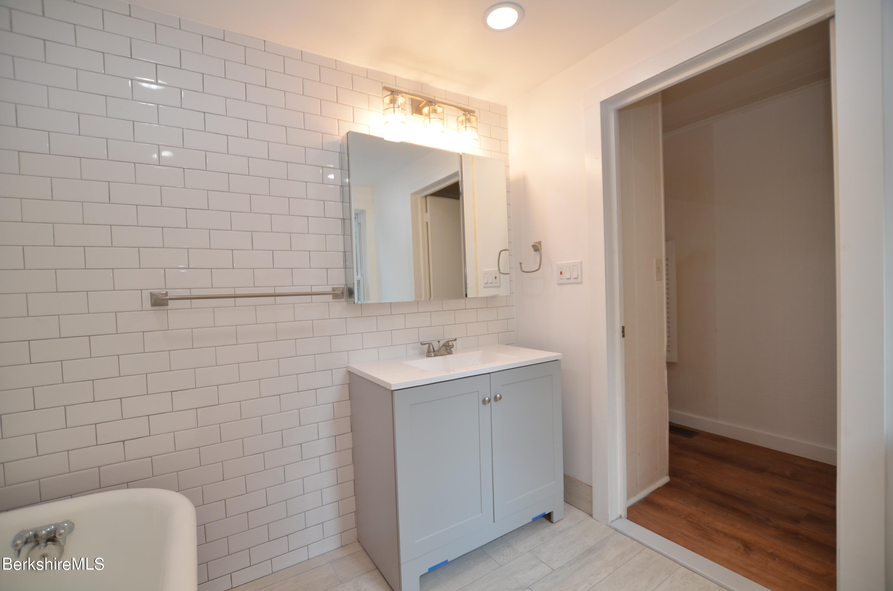 190 Willow Street Lee, MA 01260 - Photo 14 of 41 a bathroom with a sink a toilet and mirror
