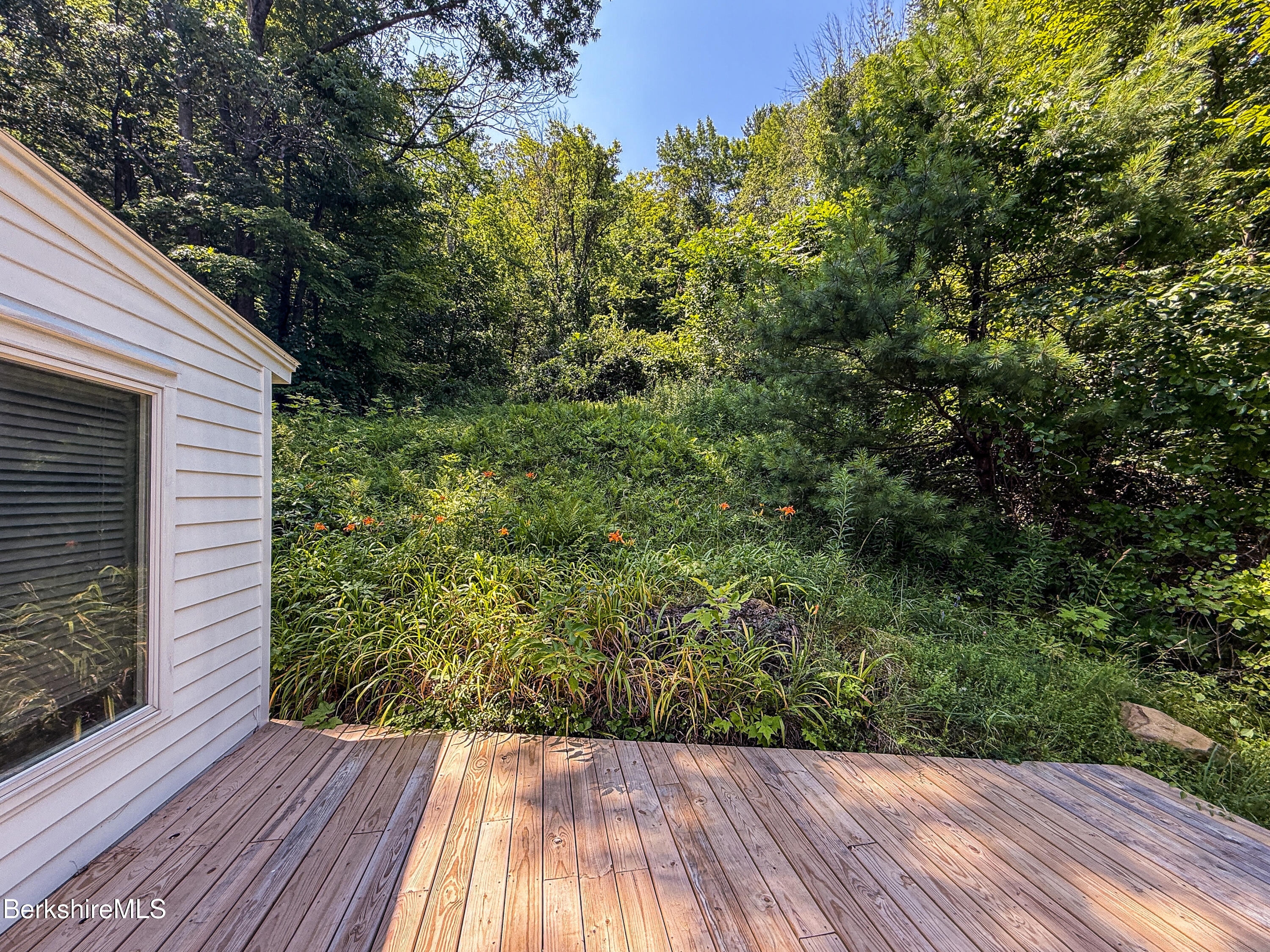 190 Willow Street Lee, MA 01260 - Photo 15 of 41 a view of balcony with wooden floor and fence