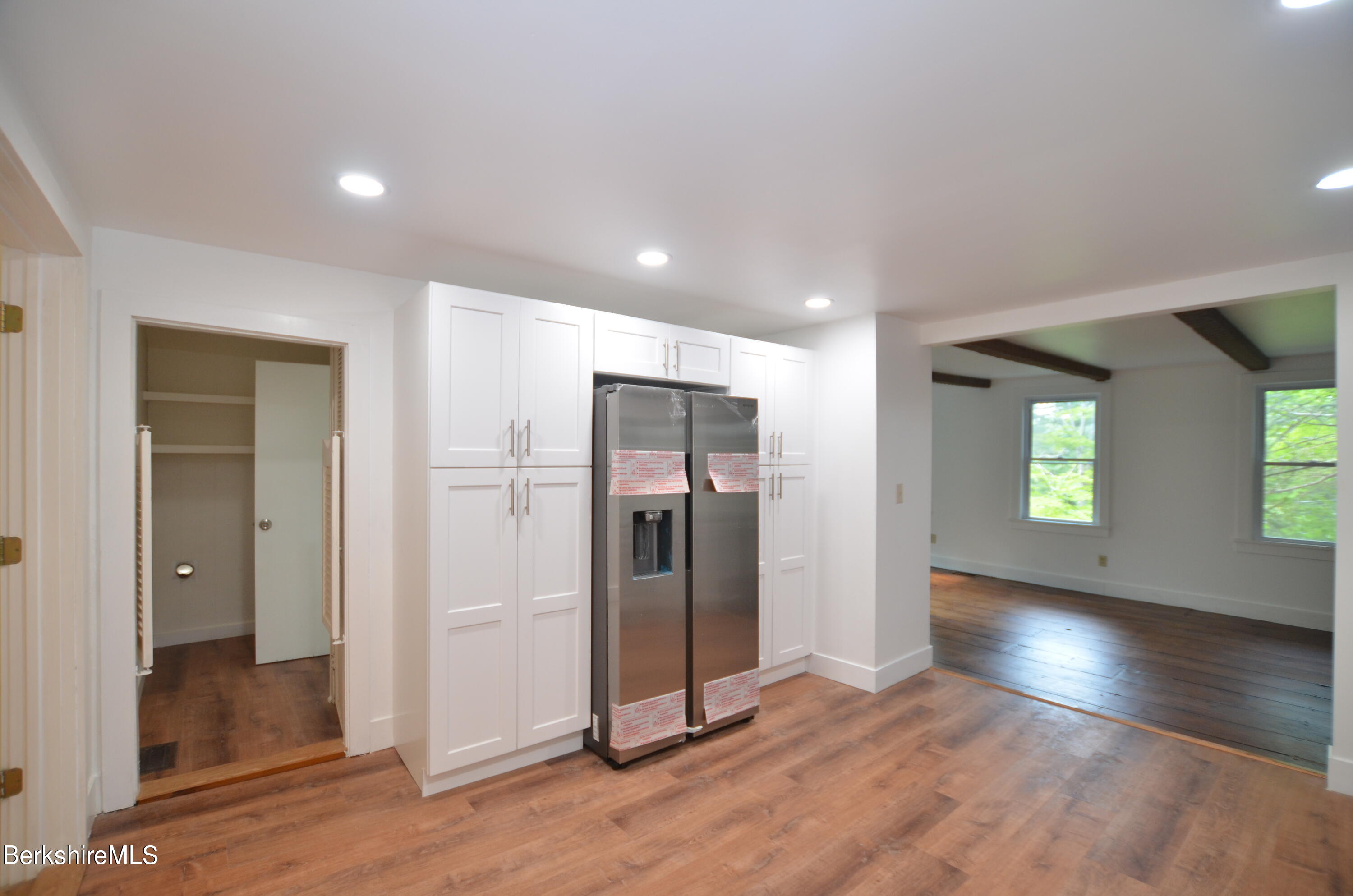 190 Willow Street Lee, MA 01260 - Photo 17 of 48 an empty room with wooden floor and windows