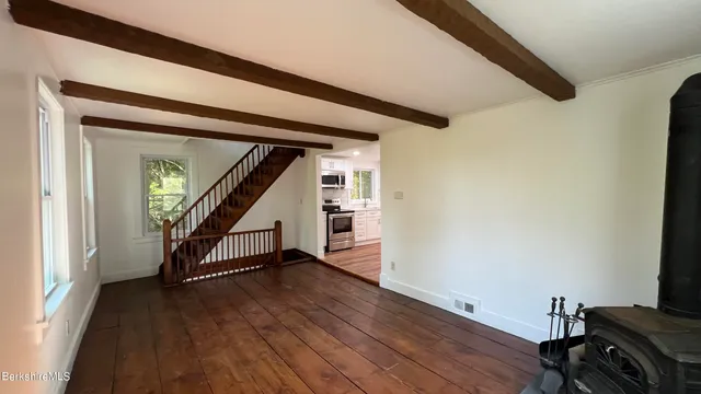 a house that has a tree in front of it