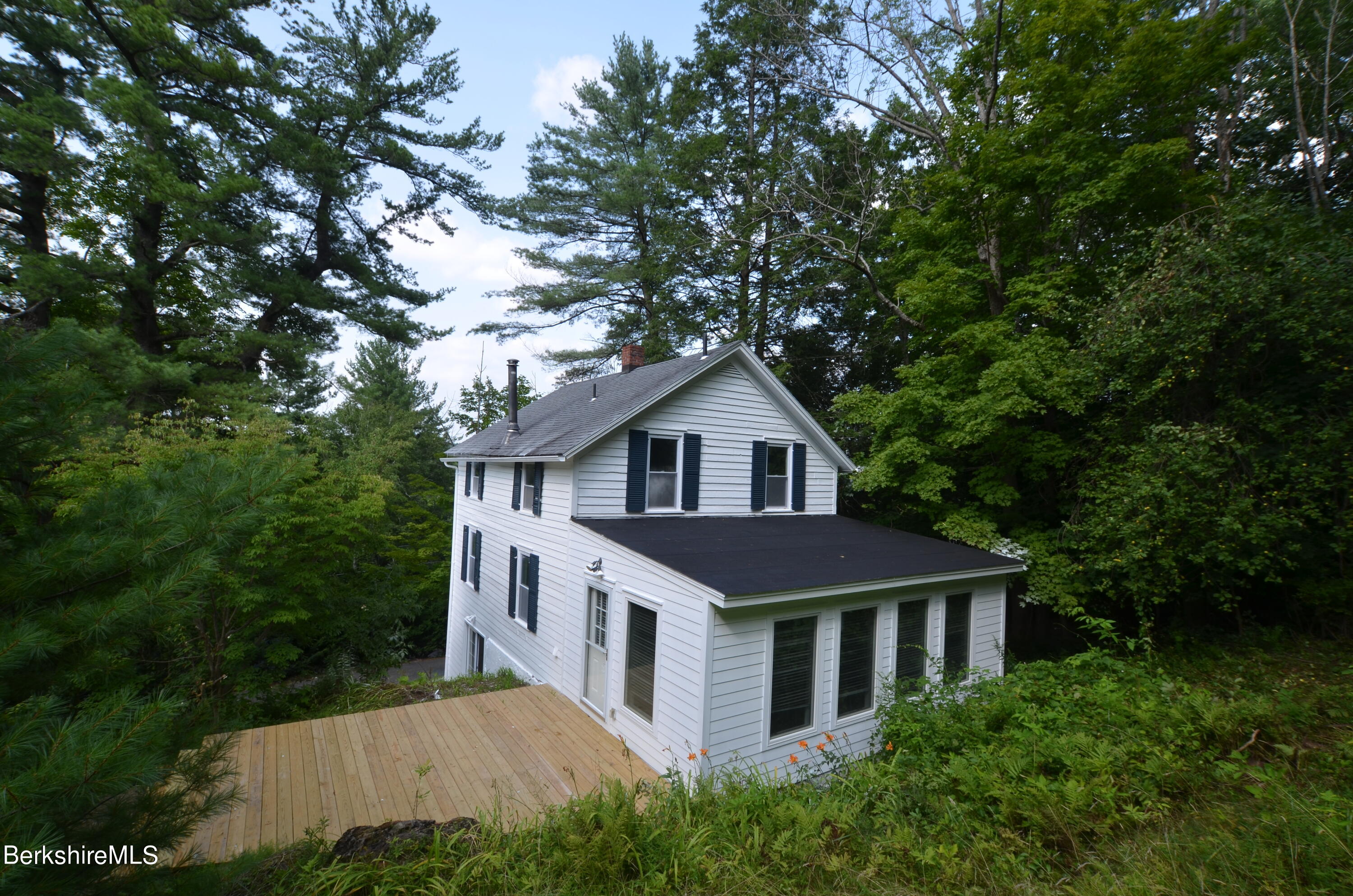 190 Willow Street Lee, MA 01260 - Photo 21 of 48 a house that has a tree in front of it