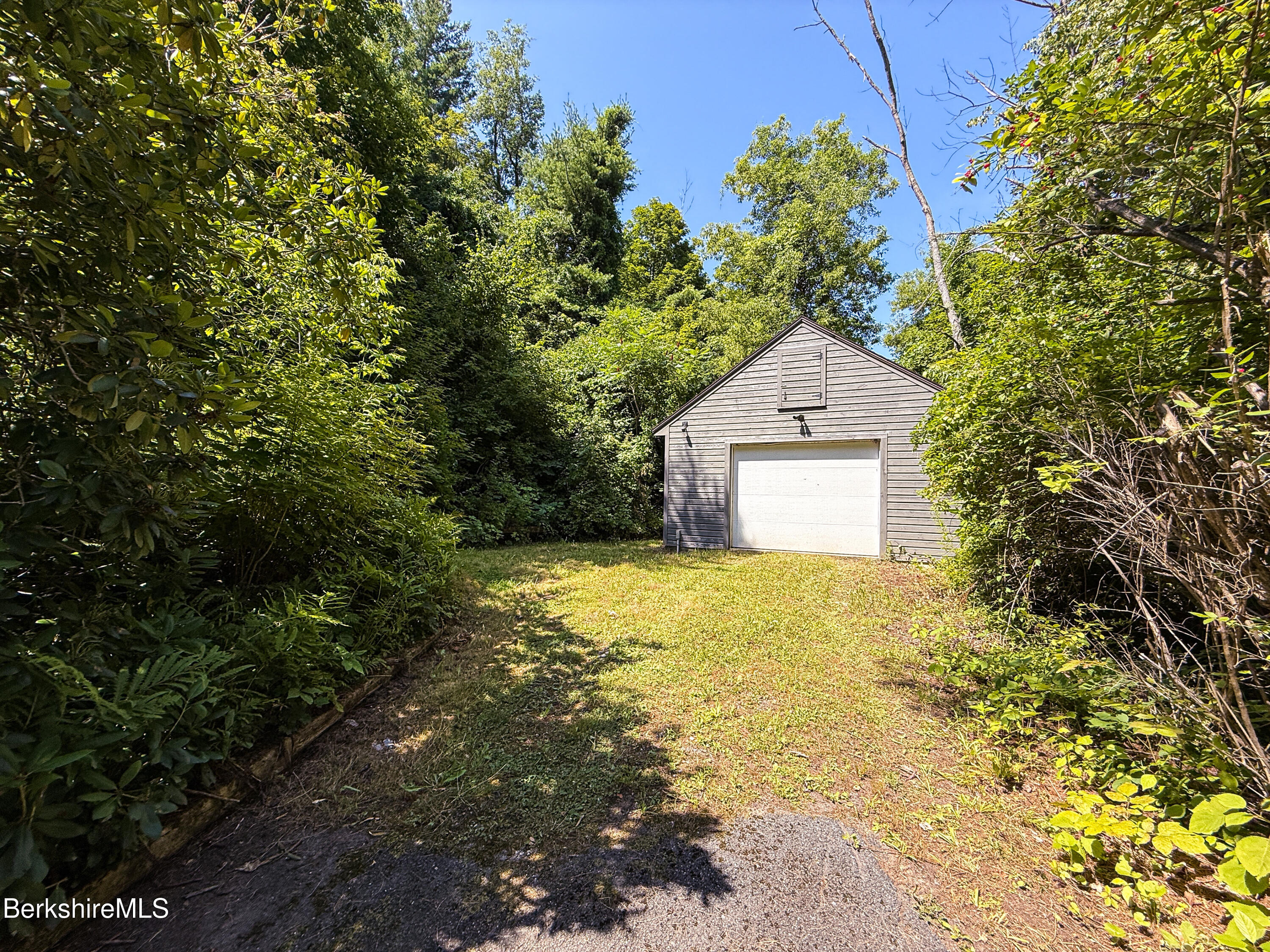 190 Willow Street Lee, MA 01260 - Photo 36 of 41 a house with trees in the background