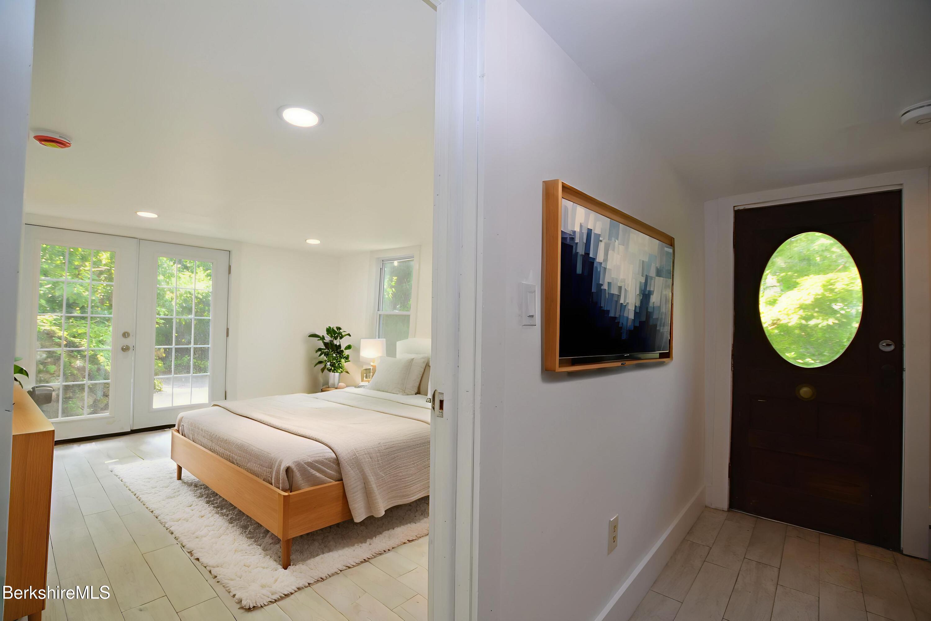 190 Willow Street Lee, MA 01260 - Photo 39 of 48 a bedroom with a bed and a window