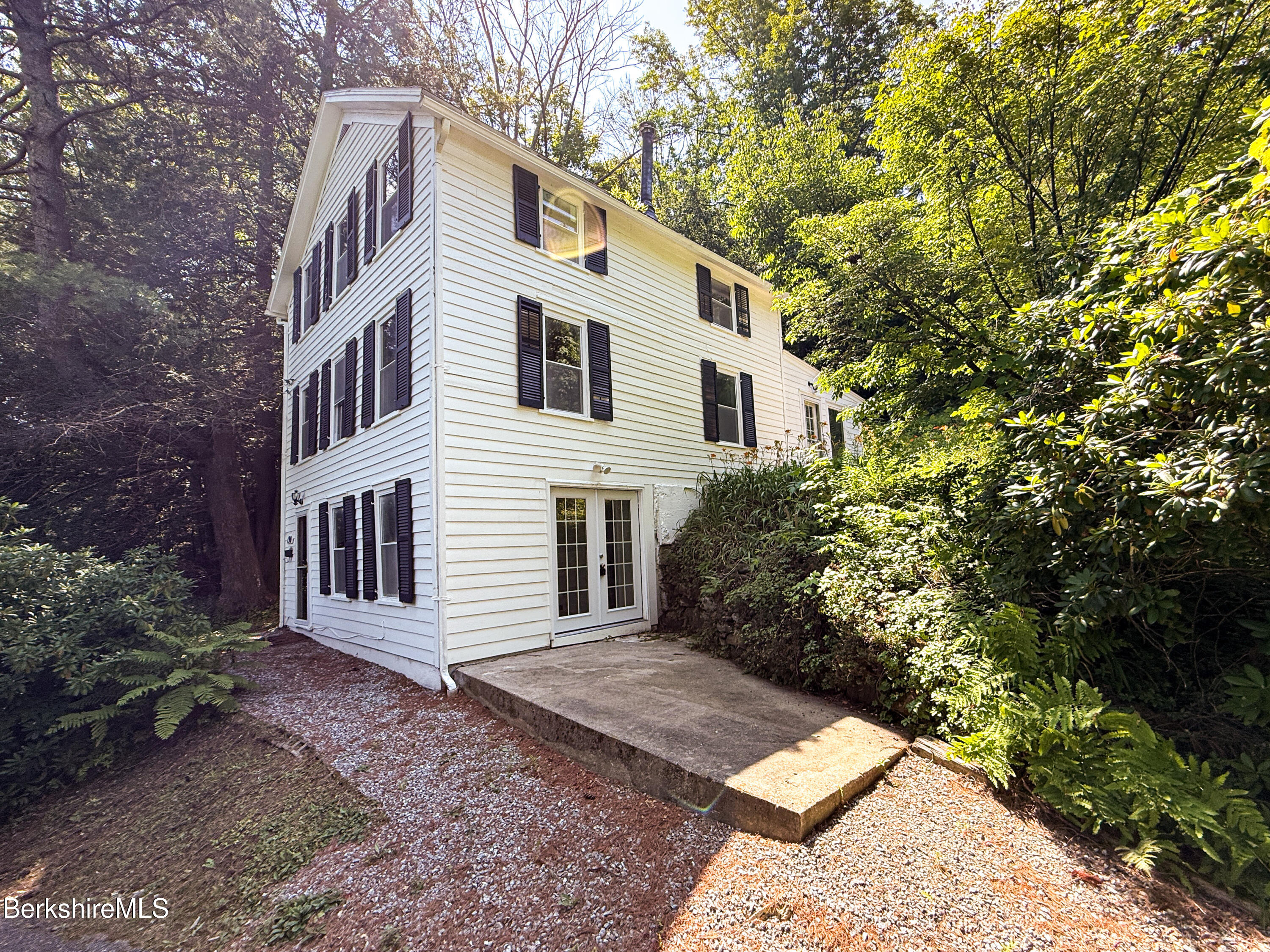 190 Willow Street Lee, MA 01260 - Photo 4 of 48 a front view of a house with garden