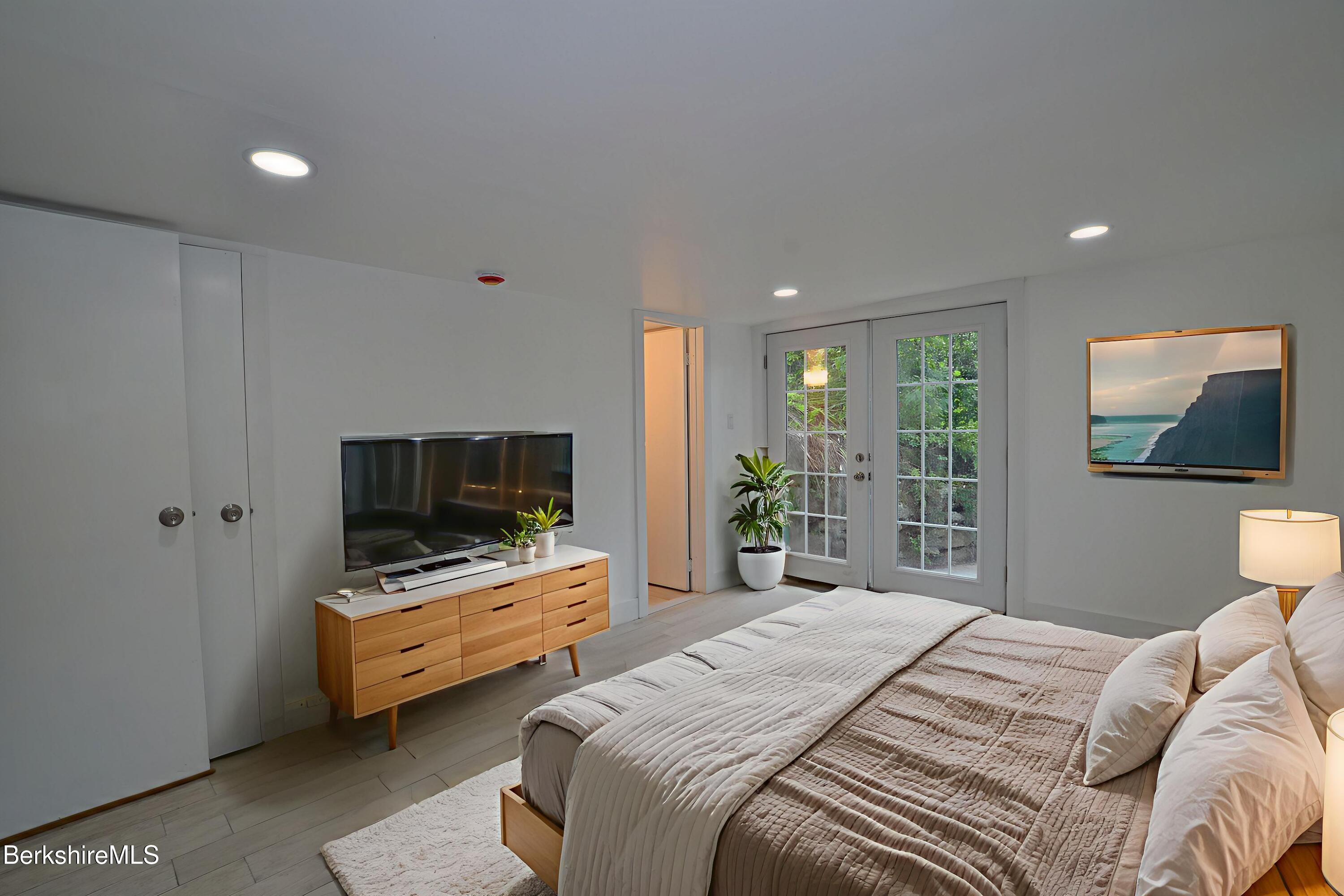 190 Willow Street Lee, MA 01260 - Photo 41 of 48 a bedroom with bed and a flat screen tv