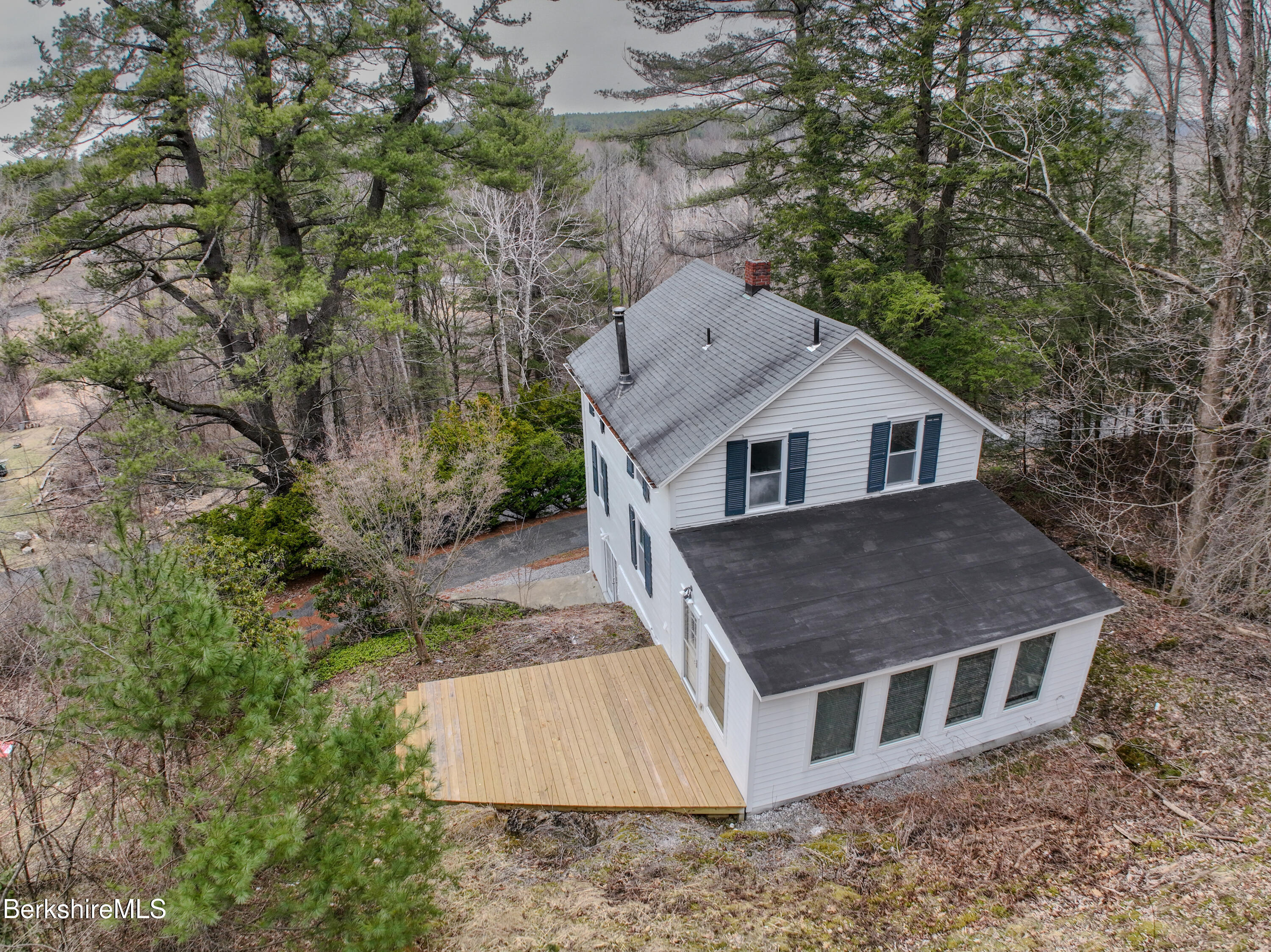 190 Willow Street Lee, MA 01260 - Photo 5 of 48 a aerial view of a house next to a yard