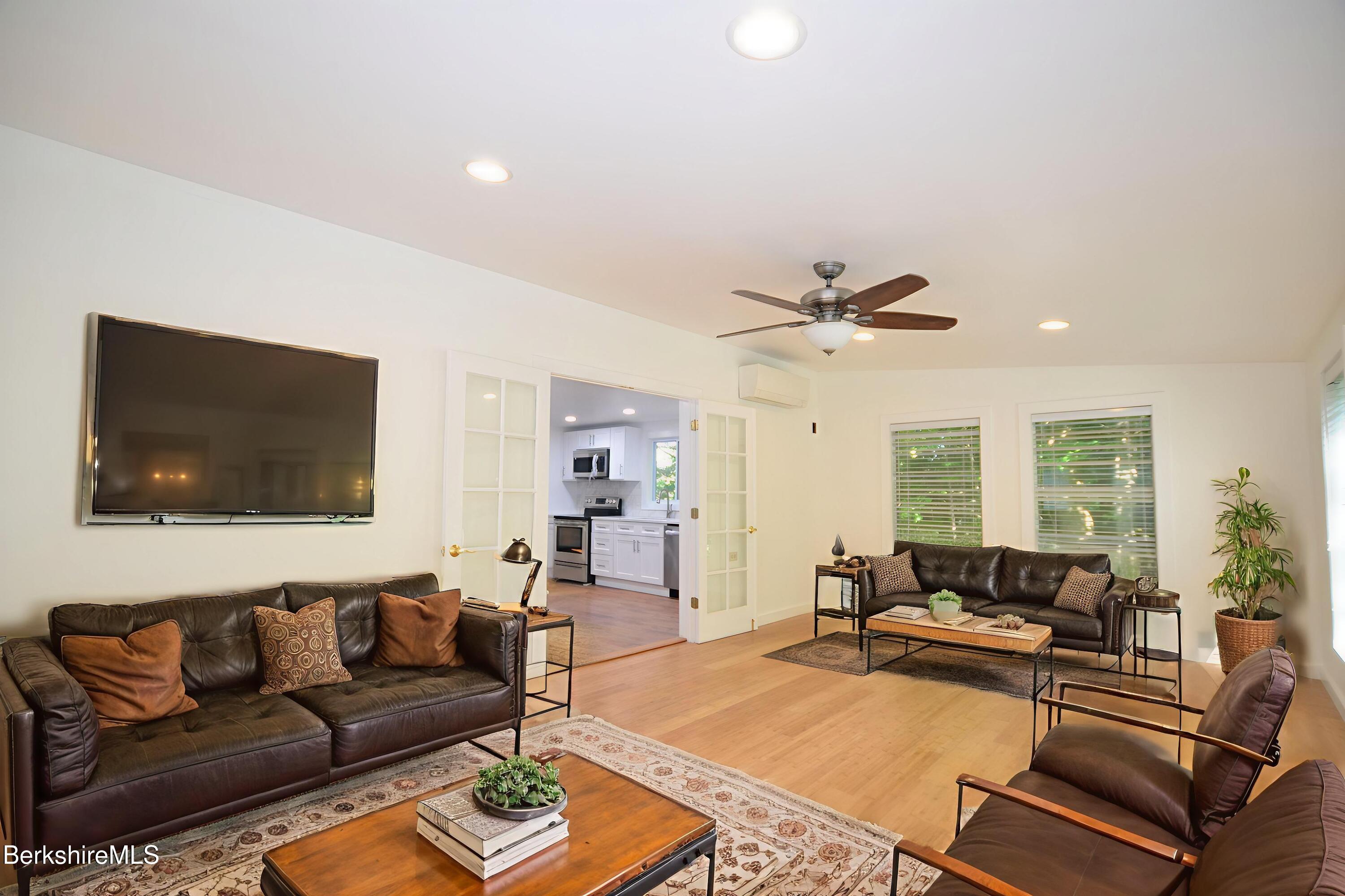 190 Willow Street Lee, MA 01260 - Photo 5 of 41 a living room with furniture and a flat screen tv