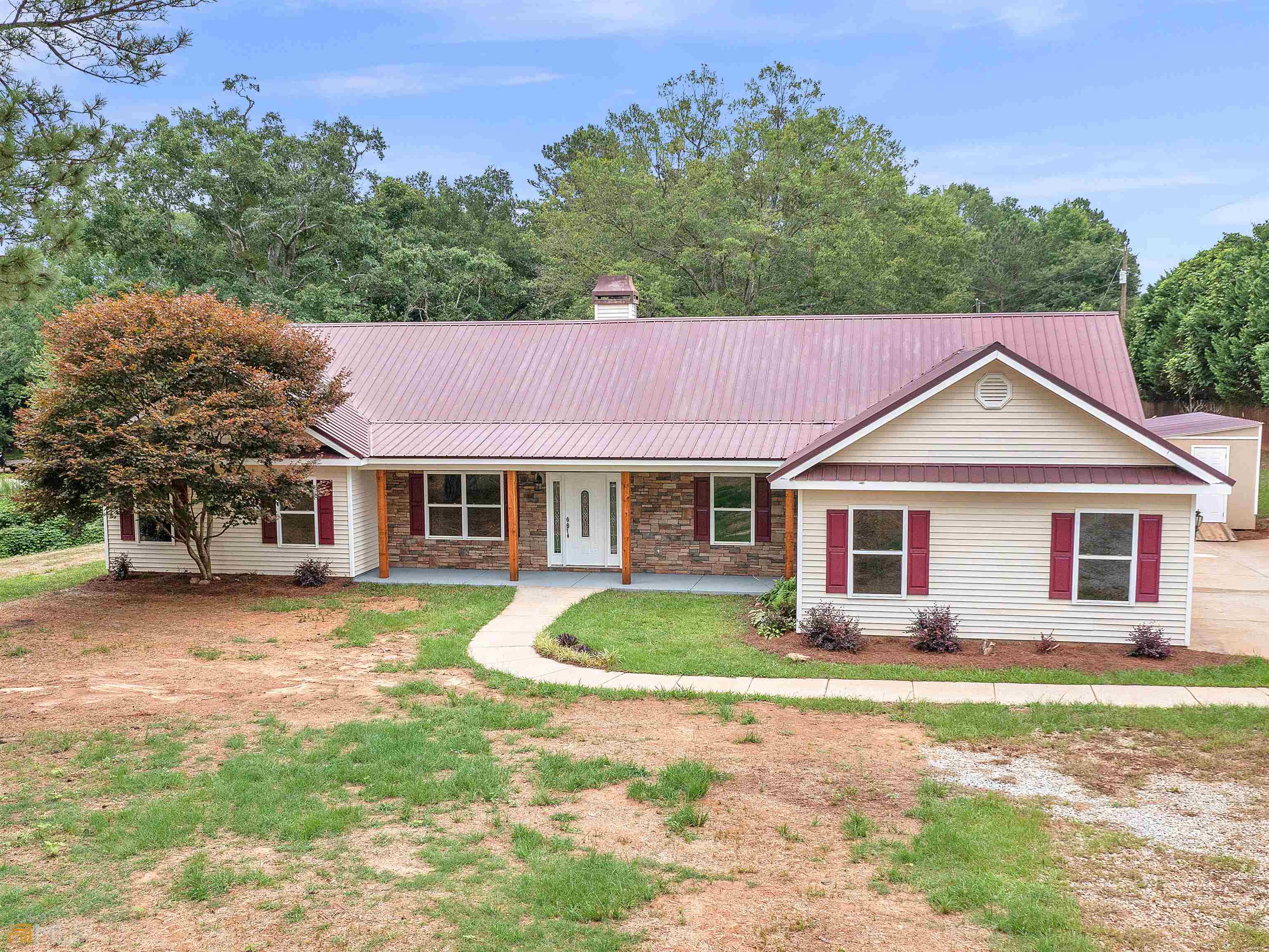 a front view of a house with a yard