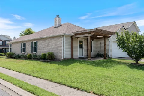a view of a house with a yard