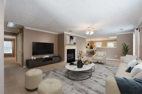 a living room with furniture and a flat screen tv