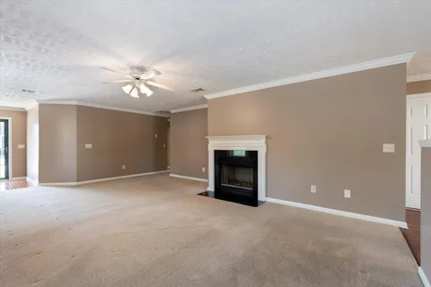 a view of an empty room with a fireplace