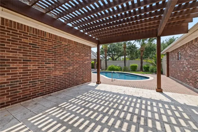 a view of pool with a yard