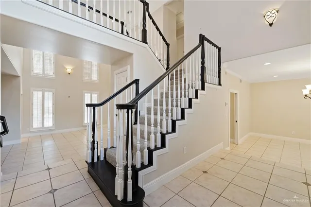 a view of entryway with stairs and a rug