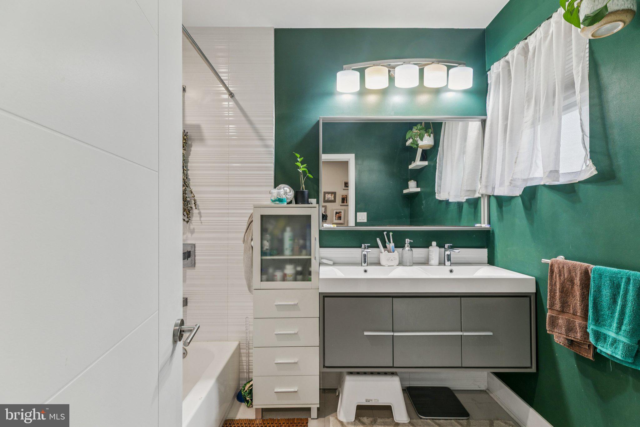 1314 North Dover Street Philadelphia, PA 19121 - Photo 19 of 30 a bathroom with a sink and a mirror
