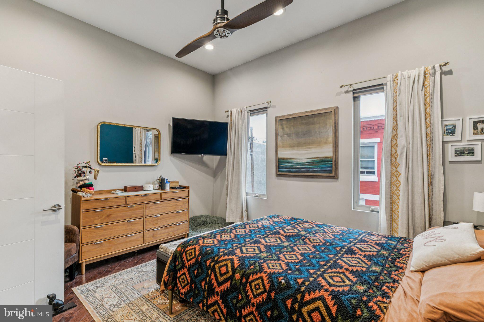 1314 North Dover Street Philadelphia, PA 19121 - Photo 22 of 30 a bedroom with a bed and flat screen tv