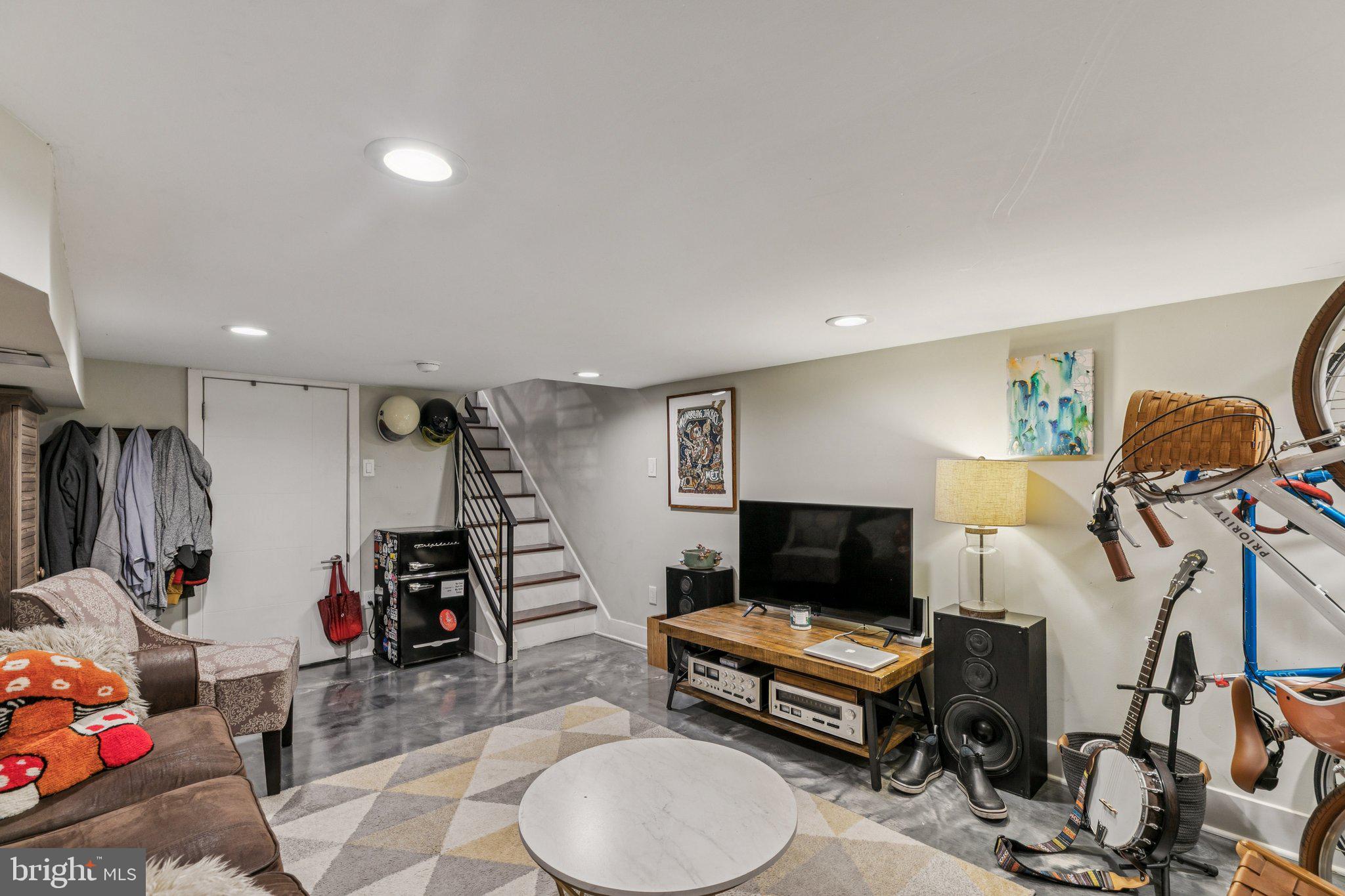 1314 North Dover Street Philadelphia, PA 19121 - Photo 26 of 30 a living room with furniture a flat screen tv and gym equipment